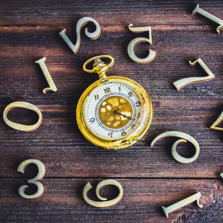 A pocket watch with numbers.の写真素材