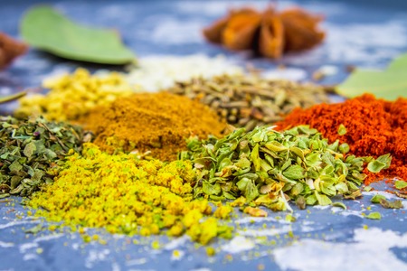 Spices and herbs on a black backgroundの写真素材