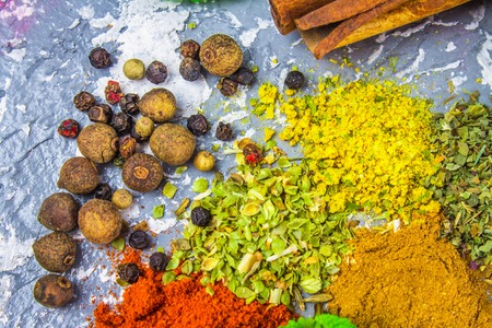 Spices and herbs on a black backgroundの写真素材