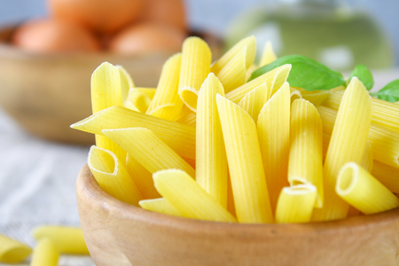 Penne rigate. Macaroni in the form of feathers. mostaccioli pastaの写真素材