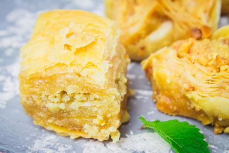 baklava turkish traditional delight on a dark wood background. toningの写真素材