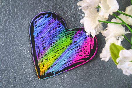 Homemade Black violet pink hearts on a gray concrete background. The concept of Valentine's Day. A symbol of loveの写真素材