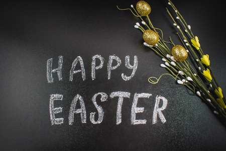 Chalk inscription Happy Easter on a chalkboardの写真素材