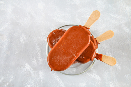 Ice cream on a glass saucer on a gray table. Eskimoの写真素材