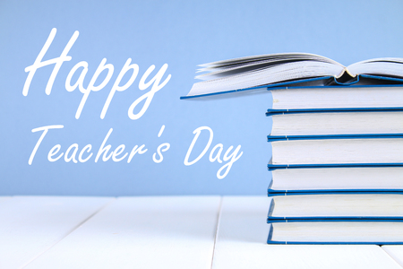 Text on paper: Happy Teacher's Day. School supplies, office, books appleの写真素材