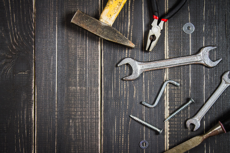 Joinery tools on a dark wooden table. Place for the text. A concept for Father's Day. Top view. Flat laying.の写真素材
