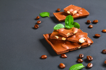 chocolate with almonds on dark grey backgroundの写真素材