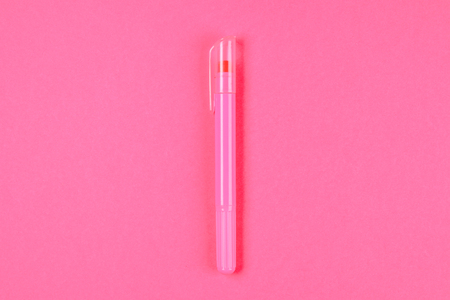 Pink felt-tip pen on a pink pastel background. Summer. Top view. Flat lay. Copy spaceの写真素材