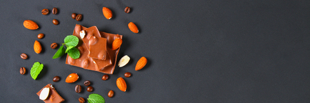 chocolate with almonds on dark grey backgroundの写真素材