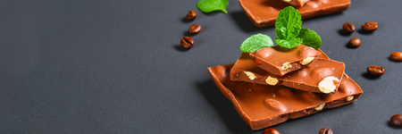 chocolate with almonds on dark grey backgroundの写真素材