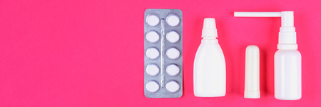 Medical remedies for colds, flu on a pink pastel background. Top view. Flat lay. Copy space