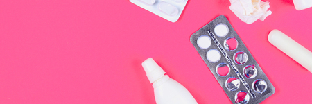 Medical remedies for colds, flu on a pink pastel background. Top view. Flat lay. Copy spaceの写真素材