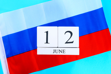 Wooden white calendar with the date of June 12 against the background of the flag of Russia. Russia Dayの写真素材