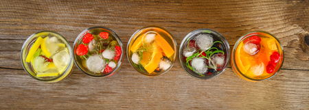 Various detox water in glasses, different tastes, berries, fruits.の写真素材