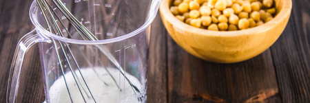 Chickpea liquid water brine draining. Vegan Aquafaba.の写真素材