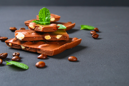 chocolate with almonds on dark grey backgroundの写真素材
