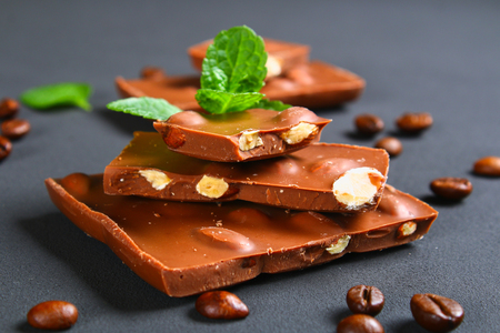 chocolate with almonds on dark grey backgroundの写真素材