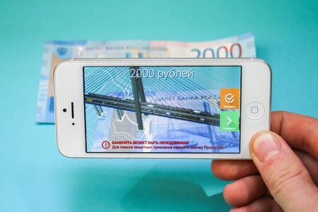 Russia, Nevinnomyssk. July 7, 2018. Projection of the new 200 Russian rubles in the phone application. Authentication. augmented realityのeditorial素材
