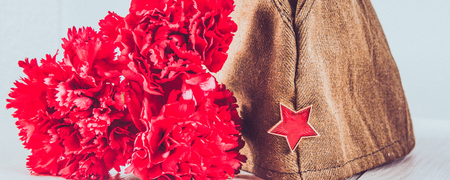 Carnation flowers, George Ribbon and military garrison cap with a red star. May 9 Victory Day.の写真素材