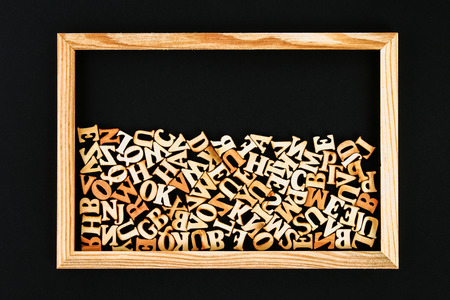 Wooden letters in a wooden frame on a chalkboard. The concept of reading, knowledge, studyの写真素材