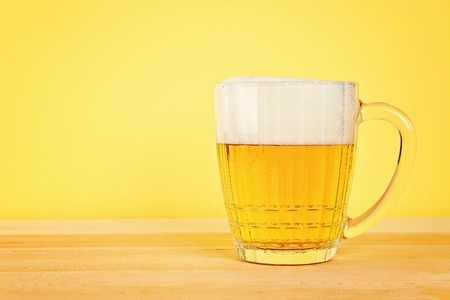 Glass beer on wood background with copy spaceの写真素材