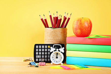 School and office supplies on a yellow background. Back to school
