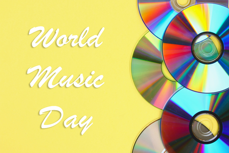 World, international music day. Piles of old and dirty CDs,DVD on pastel background. Used and dusty diskの写真素材