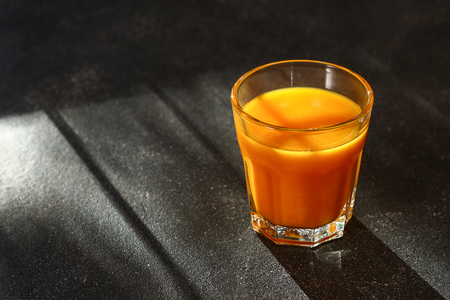 Pumpkin Smoothie Pumpkin juice on a dark table. Autumn drinksの写真素材
