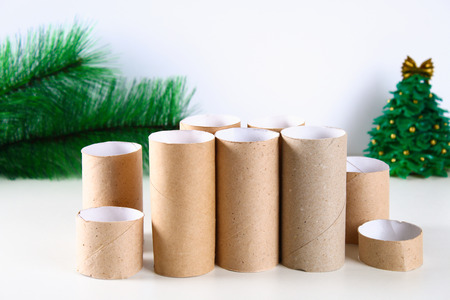 How to make white Christmas candles plugs toilet paper rolls, hot glue, paint and candles. Children's creativity. Christmas diy. Step by step on the photo, instructionsの写真素材