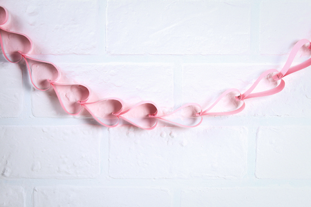 Diy. A garland of hearts for Valentine's Day. Do-it-yourself decor for February 14th. Top view. Workshop on the photo, step by step. Handicraft.の写真素材