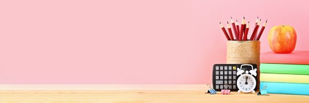 School and office supplies on a pink background. Back to schoolの写真素材