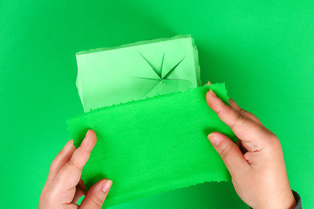 DIY leprechaun trap with gold coins, rainbow and green ladder St Patricks Day background. Gift Idea, decor Saint Patricks Day. Step by step. Child kid craft process. Top view. Irish holiday.の写真素材