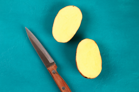 Diy Easter eggs made of cardboard and potato stamp, Easter greeting card on green background. Gift idea, decor Spring, Easter. Step by step. Top view. Process kid children craft.の写真素材