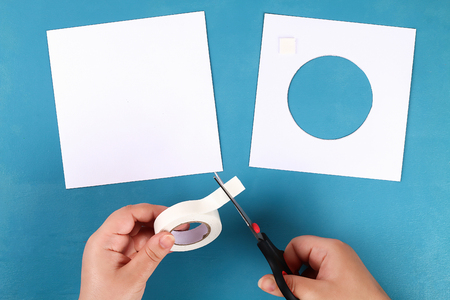 Diy Easter cards from paper. Volume greeting cards with a bunny, egg on blue background. 3d. Gift idea, decor Spring, Easter. Step by step. Top view. Process kid children craft.の写真素材