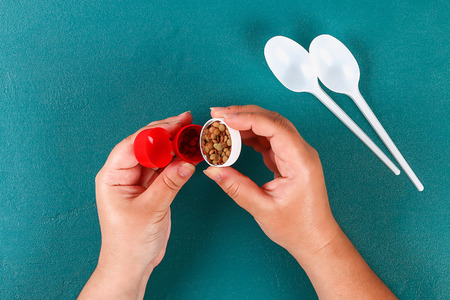 Diy cinco de mayo maracas from eggs, spoons and cereals on a green background. Gift idea, decor...