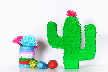 Diy cinco de mayo Mexican Pinata Cactus made cardboard and crepe paper your own hands on a blue background. Gift idea, decor, game cinco de mayo. Step by step. Top view. Process kid children craft.の写真素材
