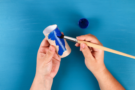 2 Diy windsocks 4th July toilet sleeve, crepe paper colors American flag, red, blue, white. Gift idea, decor July 4, USA Independence Day. Step by step. Top view. Process kid children craft. Workshopの写真素材