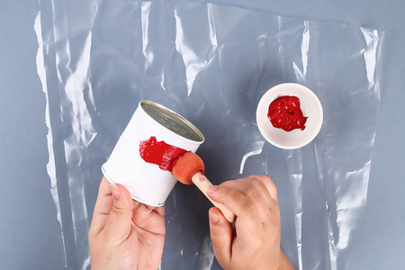 4 Diy 4th of July tin can candlestick, electric tape, paint color American flag red blue white. Gift idea decor July 4 USA Independence Day. Step by step. Top view. Process kid children craft.の写真素材