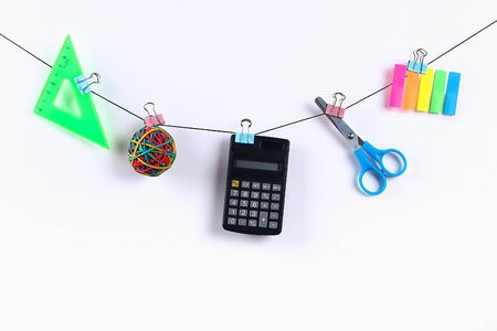 School supplies hang on the rope. School supplies on white background. Back to school conceptの写真素材