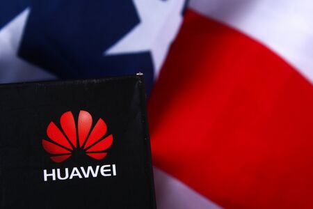 Mobile phone company Huawei on background of flag and USA dollars. The confrontation of countries US-China. Business. Stavropol, June 2019のeditorial素材