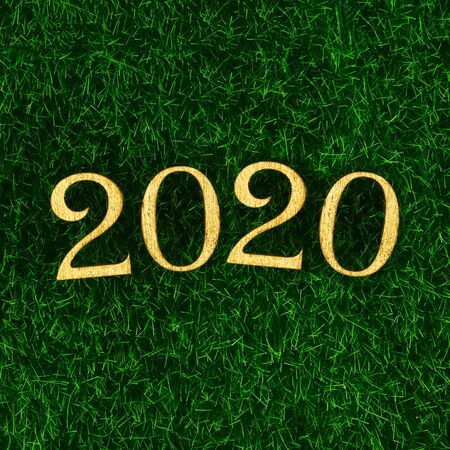 Happy New Year 2020. Creative text Happy New Year 2020 written in gold wooden letters. Merry...