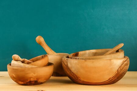 Wooden utensils. Wooden plates, cups, bowls. Dishes on the shelf Kitchenware
