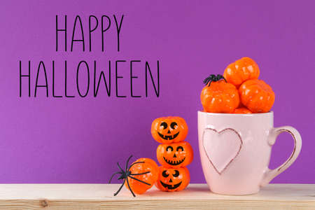 Halloween holiday concept with pumpkin decor on wooden table. Sale time.の写真素材