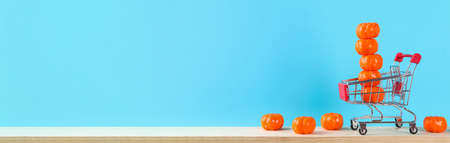 Halloween holiday concept with pumpkin decor on wooden table. Sale time.の写真素材