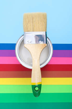 Open paint enamel cans on color palette samples. The concept of repair, construction.