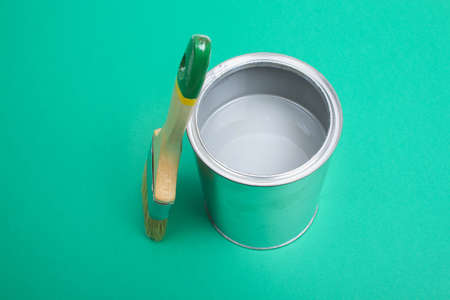 Open paint enamel cans on color palette samples. The concept of repair, construction. Shades of...