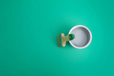 Open paint enamel cans on color palette samples. The concept of repair, construction. Shades of...