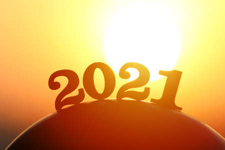 New Year 2021. The word 2021 behind the mountain at golden sunset and beautiful sky. Concept for...