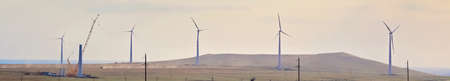 Windmill park, huge windmill generator turbines. Alternative energy. Banner