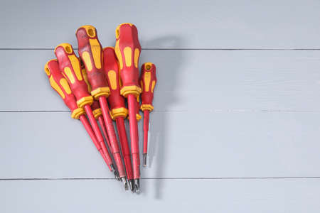 A set of a lot of different red tools for working include hammer screwdriver on gray backgroundの写真素材